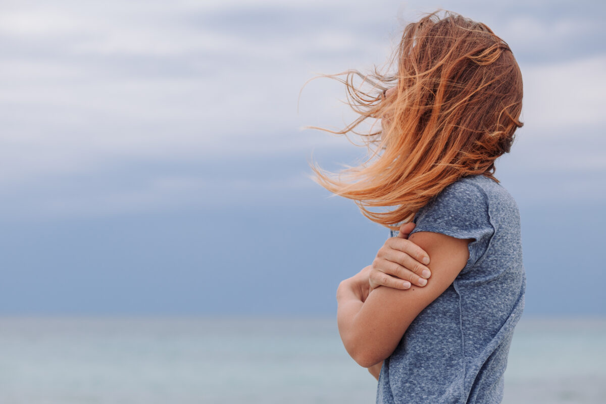 WellMind Therapy Sessions offers a sense of security and freedom as you grow - woman outdoors needing comfort